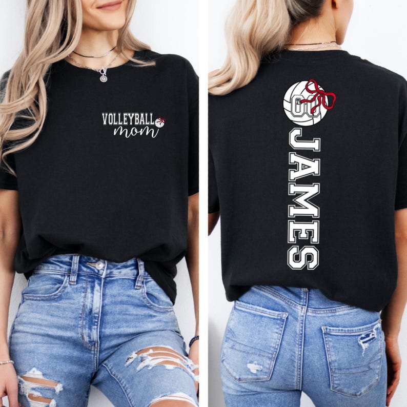 May include: Black t-shirt with the text "VOLLEYBALL mom" in white script on the front. The back of the shirt displays the name "JAMES" in white block letters, with a volleyball graphic and a red bow.