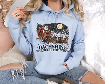 Dachshing Through The Snow Hoodie, Dachshund Christmas Hoodie, Funny Wiener Dog Holiday Gift, Cute Santa Sleigh Puppy Hoodie