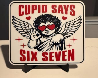 Cupid Says Six Seven – Funny 3D Printed Sign | Viral Meme Decor | Valentine’s Day Humor | Desk Shelf Gift