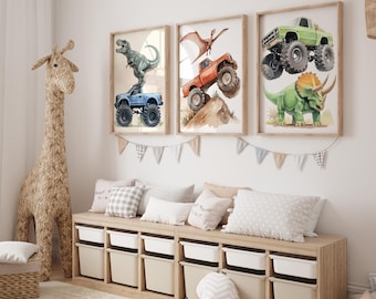 May include: Three framed watercolor prints featuring dinosaurs and monster trucks. One print shows a green dinosaur with a green monster truck. Another shows a T-Rex on a blue truck. The third shows a Pterodactyl with an orange truck.