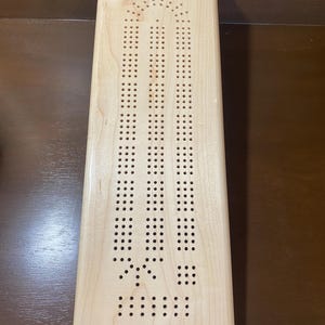 Handmade Cribbage Boards made from oak, maple, or live edge cedar.