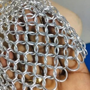 Adult-sized silver chainmail V-neck halter top, lightweight metal design, handmade for medieval warrior cosplay, LARP, and festival wear.