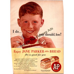May include: Vintage advert for Jane Parker White Enriched Bread. A smiling child with freckles holds a slice of bread with jam. The ad includes text that reads "Enjoy Jane Parker Bread. It's so good for you."