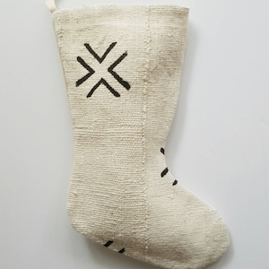 Stocking is cream with a large black X pattern