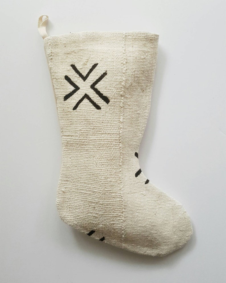 Stocking is cream with a large black X pattern