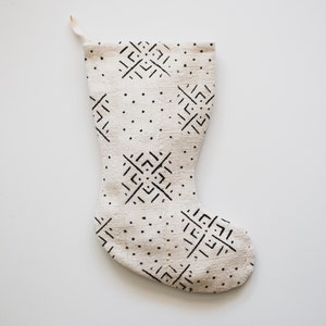 Stocking is cream with a unique X and dot pattern in black
