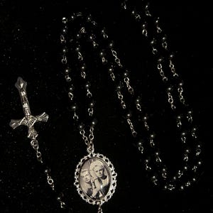 May include: A set of three ceramic mugs with a speckled, matte finish. The mugs are in shades of cream, light gray, and dark gray. Each mug has a simple, minimalist design, perfect for coffee or tea.