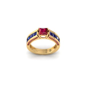 May include: A gold ring with a square, red gemstone at the center. The ring is flanked by blue and pink gemstones. The ring has the text "truegemsjewels" engraved on the band.