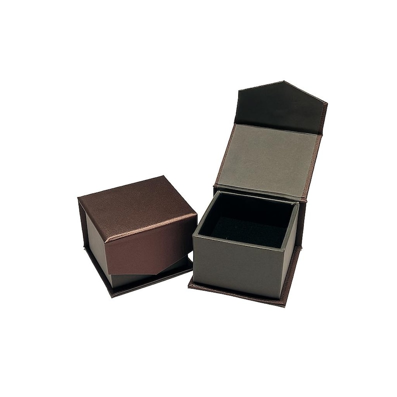 May include: Two brown jewelry boxes, one open and one closed, against a white background. The open box reveals a black interior, likely for displaying a ring or other small jewelry item. The boxes have a textured, metallic finish.