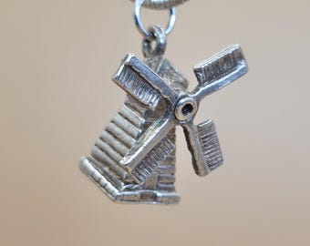 Amuleto de molino de viento de plata vintage: souvenir holandés de los años 60 con aspas giratorias