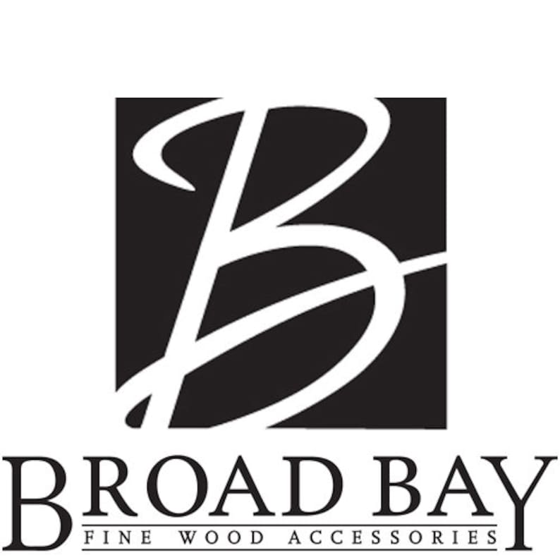 May include: Black and white logo for Broad Bay Fine Wood Accessories. The logo features a stylized letter "B" in a square.