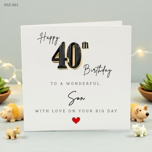 Peut inclure: Carte de vœux blanche avec le texte "Joyeux 40e anniversaire à un fils merveilleux avec amour en ce grand jour". Le chiffre 40 est noir avec un contour doré, et un cœur rouge en bas.