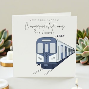 Puede incluir: Tarjeta de felicitación blanca con una ilustración de tren azul. La tarjeta dice "Next Stop: Success" y "Congratulations Train Driver Jersy" en escritura negra. El tren está sobre vías.