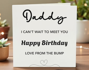 May include: A white birthday card with the word "Daddy" in a cursive font. The card also includes the phrases "I can't wait to meet you," "Happy Birthday," and "Love from the bump," with a heart illustration.