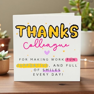 Könnte beinhalten: Eine weiße Grußkarte mit den Worten "THANKS Colleague" in Gelb und Pink. Die Karte enthält auch "FOR MAKING WORK FUN SUPPORTIVE, AND FULL OF SMILES EVERY DAY!" mit Stern- und Herzakzenten.