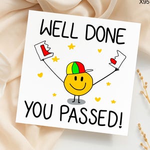 May include: A white greeting card with the words "WELL DONE YOU PASSED!" in black. The card features a yellow smiley face wearing a green, red, and yellow cap, holding up two red and white certificates. Yellow stars and hearts are scattered around the image.
