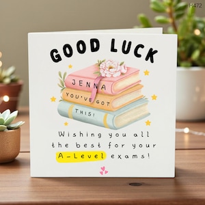 May include: A white square card with the words "GOOD LUCK" in large black letters. The card features a stack of three books with the names "JENNA", "YOU'VE GOT", and "THIS!" on them. The card also says "Wishing you all the best for your A-Level exams!"