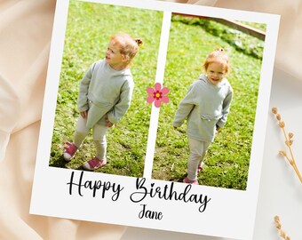 May include: A white photo card with two images of a young child in a gray hoodie and pink shoes, standing on grass. The card has the text "Happy Birthday Jane" in black script, and a pink flower graphic.