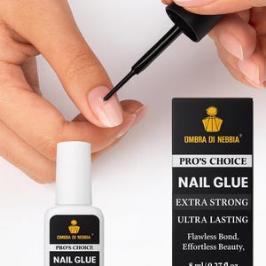 May include: A bottle of nail glue with the text "Ombra Di Nebbia Pro's Choice Nail Glue Extra Strong Ultra Lasting". A black applicator is applying the glue to a fingernail. The bottle contains 8 ml / 0.27 fl oz.