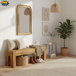 May include: A wooden bench with two beige pillows, a woven basket, and a brown blanket. A gold-framed mirror hangs on the wall, and a potted plant sits in the corner. The room is decorated in neutral tones.