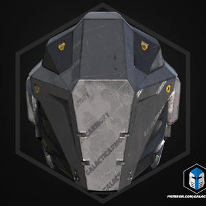 May include: A futuristic helmet in grey and black, showing signs of wear. The design includes multiple panels and rivets, with the text "GALACTICARMORY" and a logo. The helmet has yellow accents and a geometric shape.