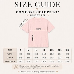May include: A light pink Comfort Colors unisex tee shirt with a size guide. The guide shows measurements in inches for width, length, and sleeve length, ranging from size S to 4XL. The text reads "Relaxed unisex fit. Size up for an oversized look."