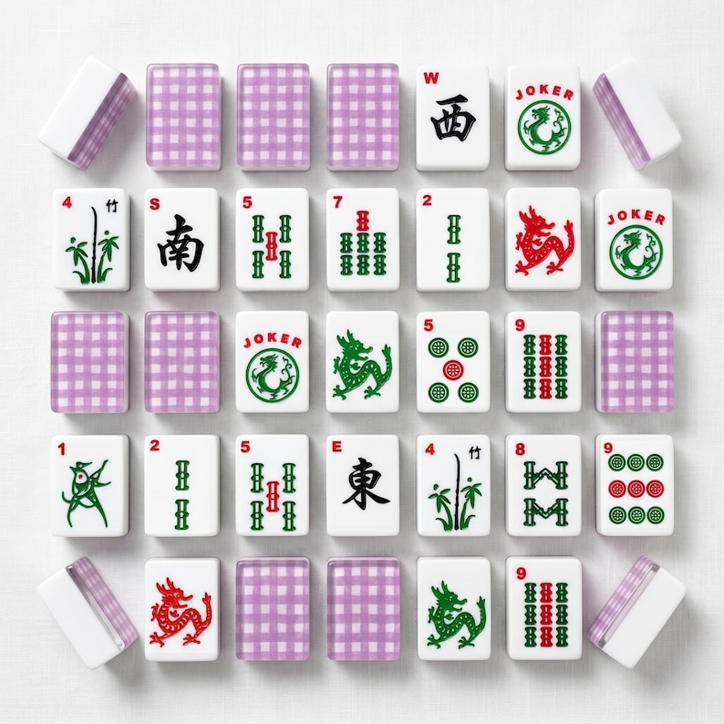 May include: A complete Mahjong set with white tiles featuring various symbols, numbers, and Chinese characters in red, green, and black. Includes purple checkered tile racks and white dice.