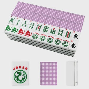 May include: A complete Mahjong set with white tiles featuring green and red dragon designs, numbers, and Chinese characters. The set includes purple checkered card decks and a white case. The "Joker" tiles have a green dragon.