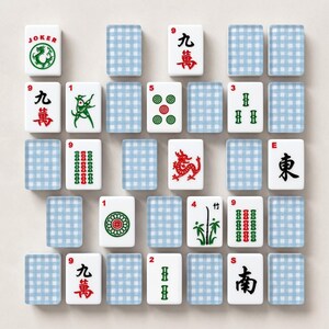 May include: A collection of Mahjong tiles, featuring various symbols, numbers, and Chinese characters. The tiles are white with red, green, and black details. Some tiles have a dragon, bamboo, and other designs. Blue checkered tiles are also present.
