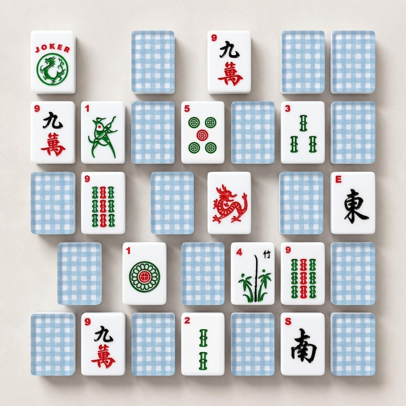 May include: A collection of Mahjong tiles, featuring various symbols, numbers, and Chinese characters. The tiles are white with red, green, and black details. Some tiles have a dragon, bamboo, and other designs. Blue checkered tiles are also present.