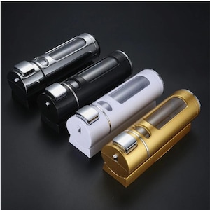 May include: Four contemporary soap dispensers in silver, black, white, and gold. Each has a rectangular base, a cylindrical body with a clear window, and a silver pump. The dispensers are arranged diagonally.