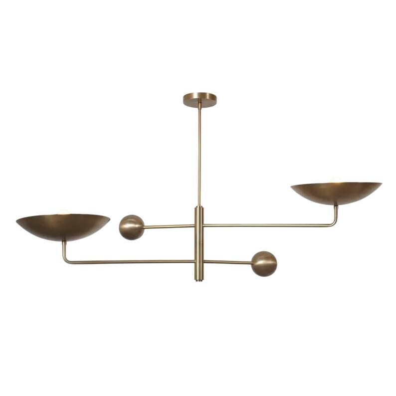 May include: A brass-toned, modern chandelier with a central vertical rod and horizontal arms. Two bowl-shaped shades and two spherical accents are positioned along the arms. The fixture is designed for ceiling mounting.