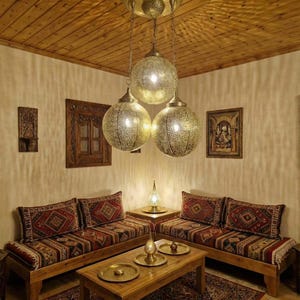 View of the brass ceiling canopy and adjustable chain for the Moroccan lamp.