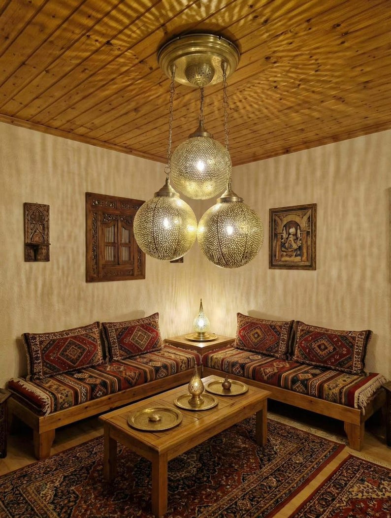 View of the brass ceiling canopy and adjustable chain for the Moroccan lamp.
