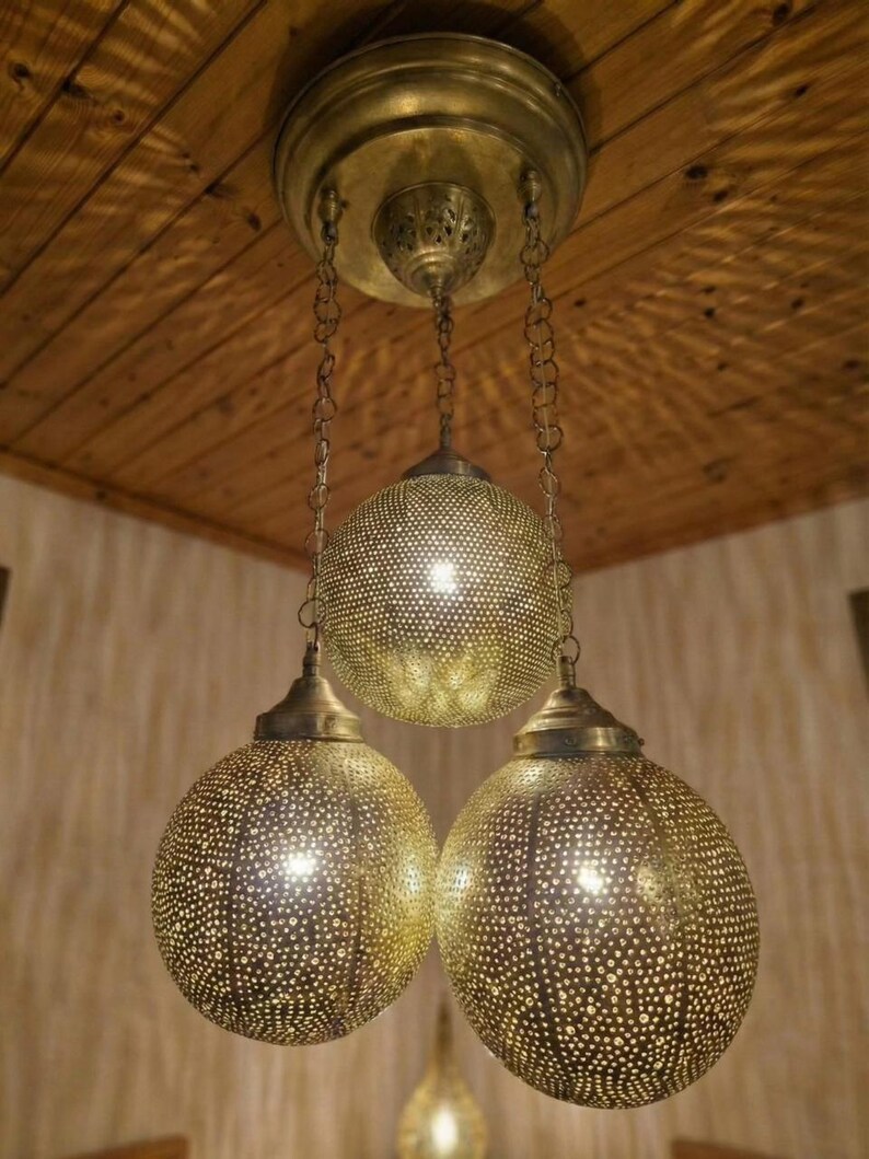 Wide shot of a Moroccan light fixture as a center piece in a modern bohemian home.