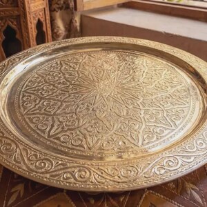 "Moroccan tray table setup with a wooden folding stand (stand sold separately)."