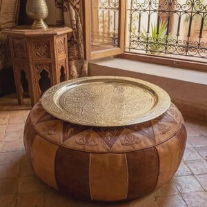 "Light reflecting off the polished surface of a handmade Moroccan tea tray."