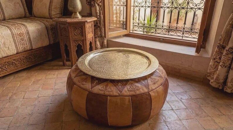 "Light reflecting off the polished surface of a handmade Moroccan tea tray."