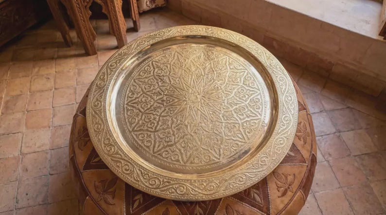 "Detail of the center star motif on a traditional Fes-style brass platter."