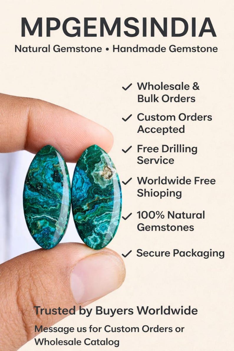 May include: Two oval-shaped, natural gemstones with a teal and green marbled pattern are held between fingers. The image includes text: MPGEMSINDIA, Natural Gemstone, Wholesale & Bulk Orders, Custom Orders Accepted, Free Drilling Service, 100% Natural Gemstones.