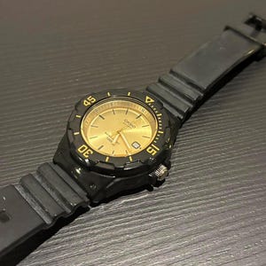 Casio Diver Style Quartz Watch | Black Gold Sunburst Dial, 100M Water Resistant Bezel
