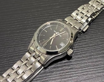 The Clock House 1964 Quartz Vintage Dress Watch — Black Dial / Silver Bracelet