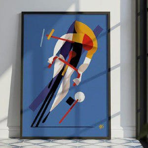 May include: Abstract art print of a cyclist in motion, with a vibrant colour palette of blue, yellow, red, and white. The artwork is framed in black and leans against a white wall, creating a modern aesthetic. The print is displayed in a room with a tiled floor.