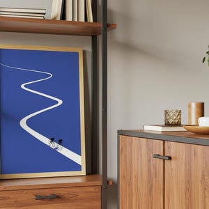 Minimalist illustration of two cyclists on a white winding road over a solid blue background, emphasizing movement and endurance.