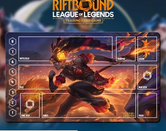 May include: A rectangular Riftbound League of Legends trading card game playmat. The mat features a dynamic illustration of a female warrior in red and black attire, set against a fiery background. The mat includes labeled zones for gameplay and the text "WITH CARD ZONES OR NO ZONES".