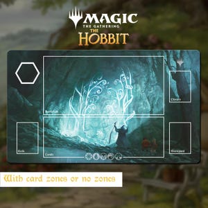May include: A rectangular Magic The Gathering The Hobbit playmat featuring a dark forest scene with a glowing blue portal, a wizard, and two small figures. The mat includes white outlined zones for Battlefield, Lands, Library, Exile, and Graveyard.
