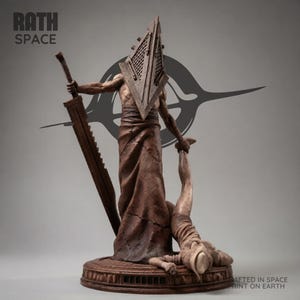 May include: A white ceramic mug with a black handle and the text "But First, Coffee" in a black, handwritten-style font. The mug is on a white surface.