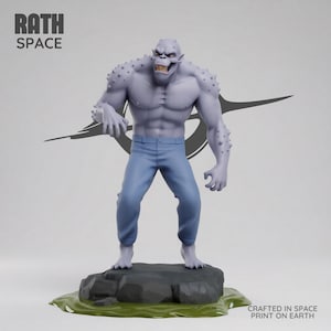 May include: A gray monster figure with blue pants stands on a rock base with green accents. The figure has sharp teeth and spiky protrusions. The text "RATH SPACE" is at the top left. The text "CRAFTED IN SPACE PRINT ON EARTH" is at the bottom right.