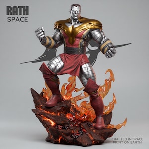 May include: A Colossus statue with a silver metallic body, gold accents, and red clothing, standing on a fiery base. The statue is from Rath Space, with the text "Crafted in Space Print on Earth".