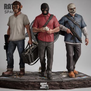 May include: A detailed statue featuring three figures in a crime-themed setting. One figure wears a monkey mask, another a black ski mask, and the third a skull mask. Each figure is dressed in casual attire and holding weapons or money. The base features the text "grand theft auto".